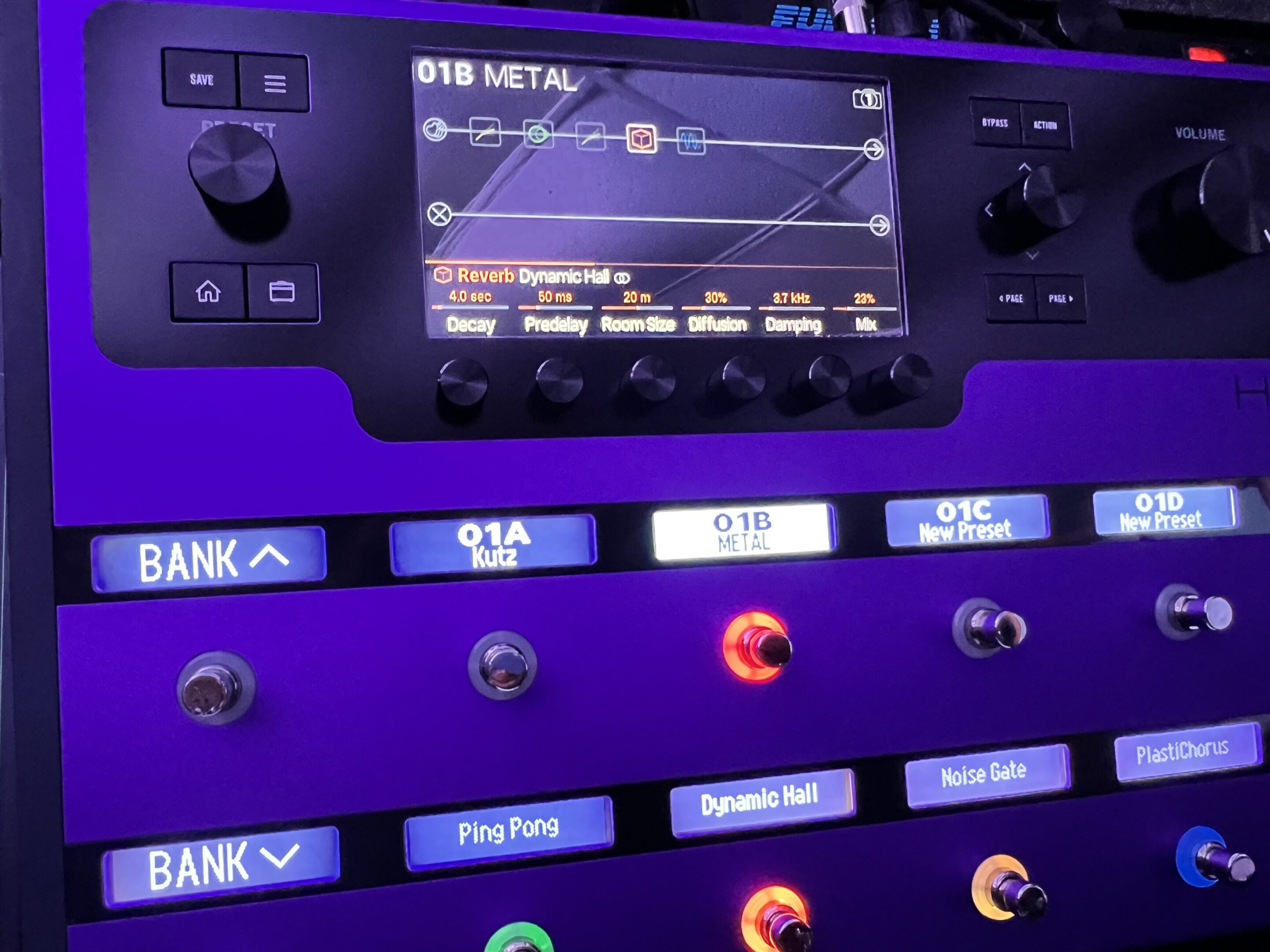 Guitar effects pedalboard with digital screen.