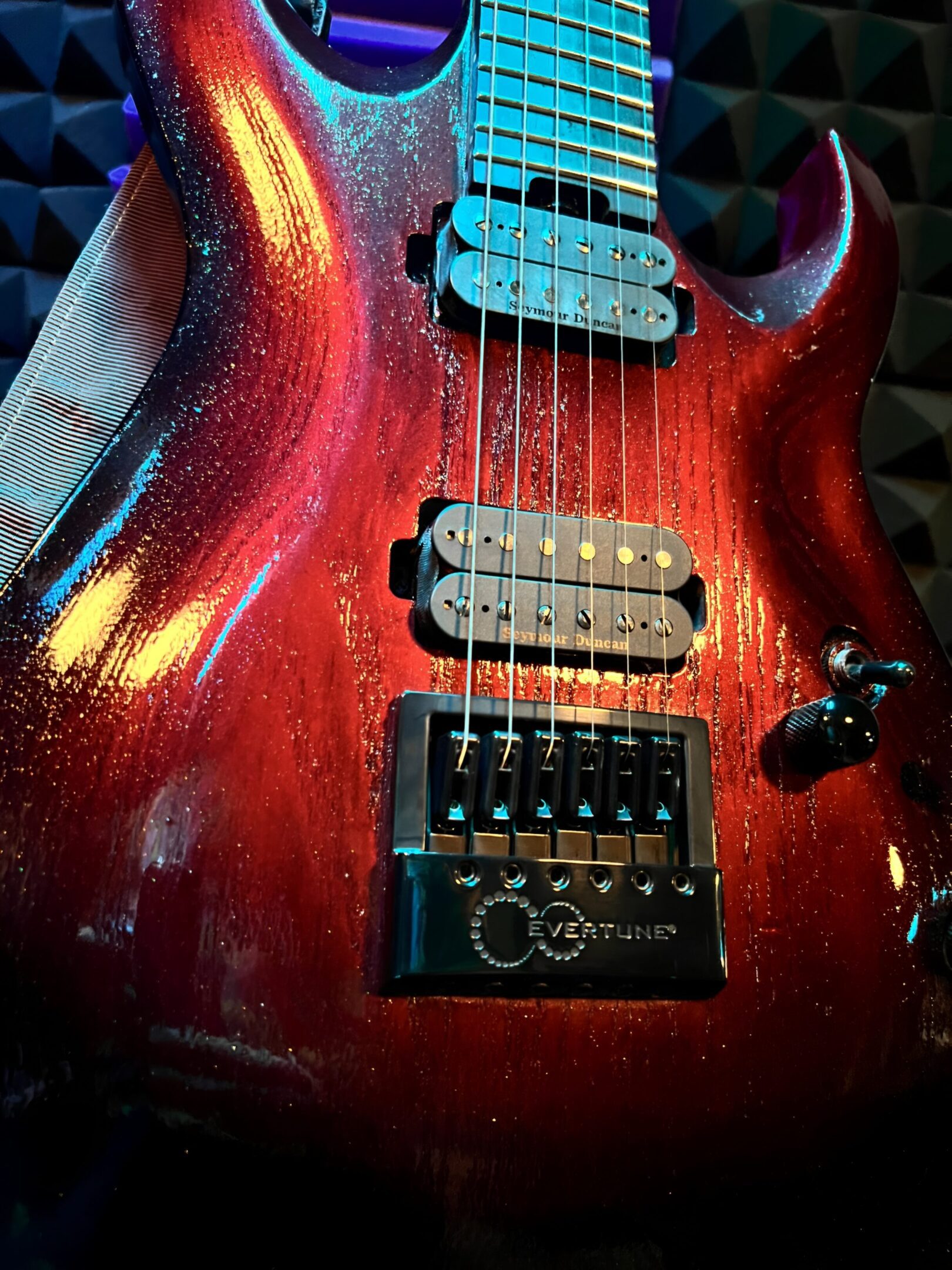 Electric guitar with vibrant red finish.