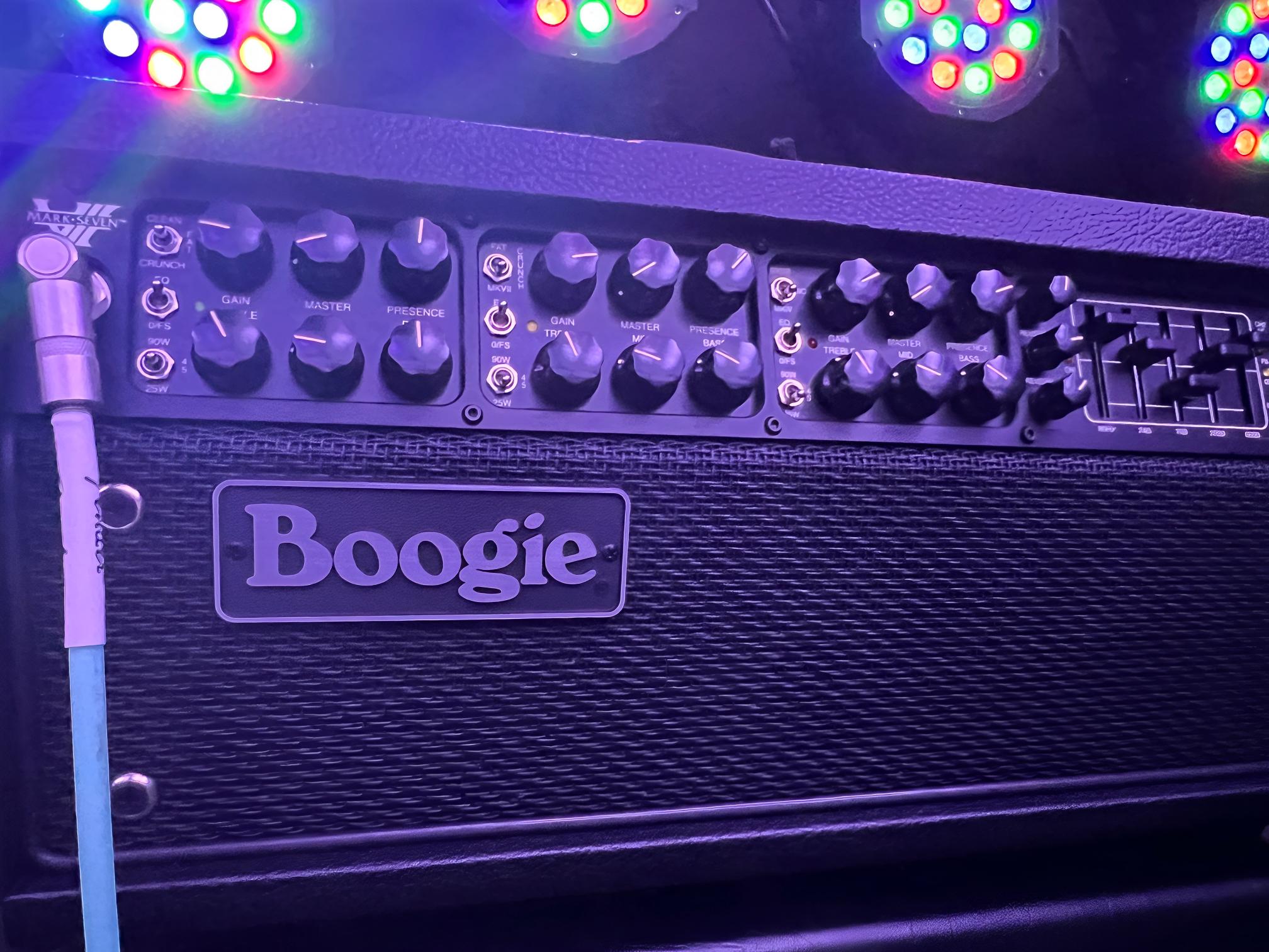 Guitar amplifier with colorful lights on top.