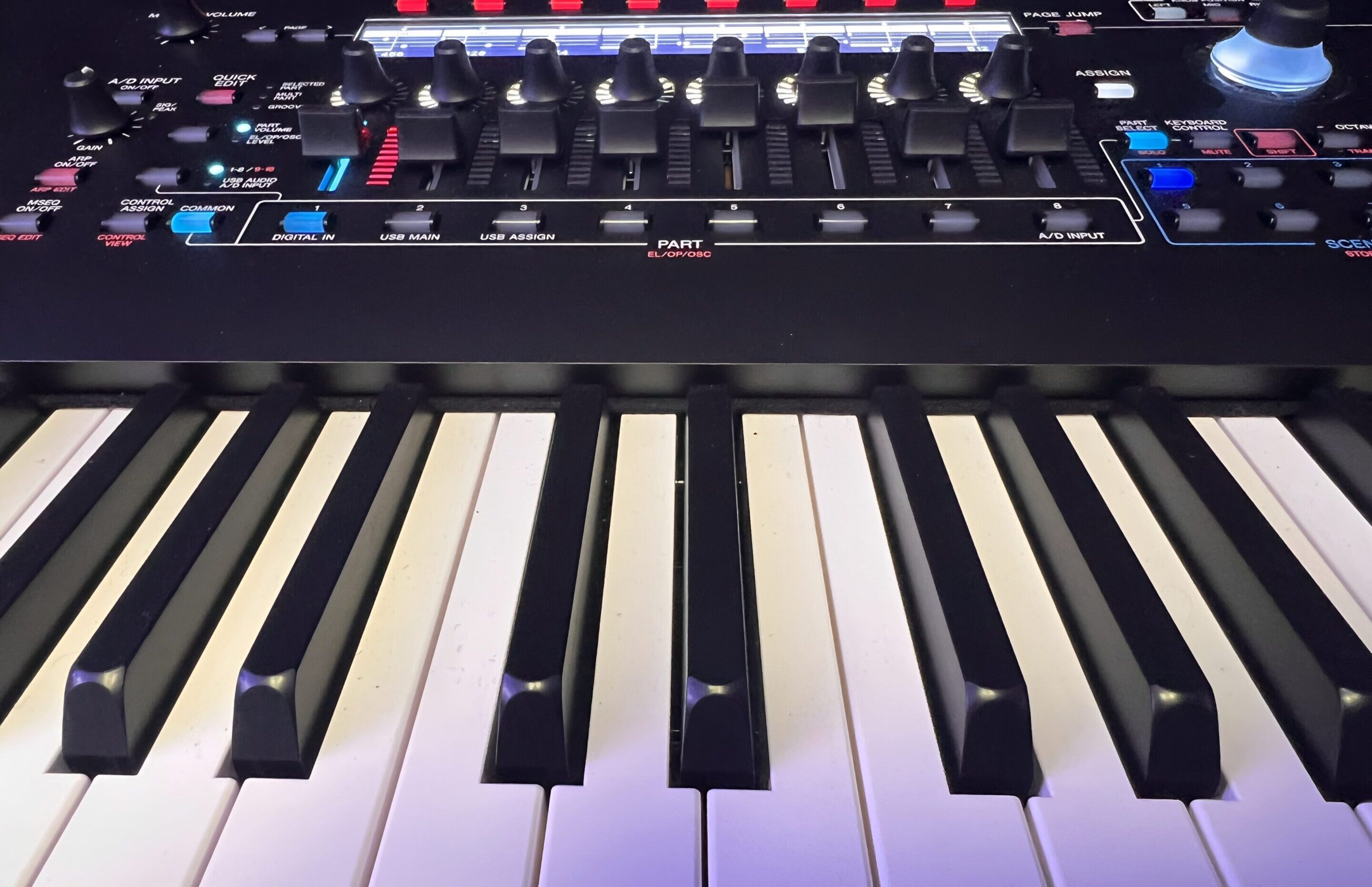 Electronic keyboard with control knobs and keys.